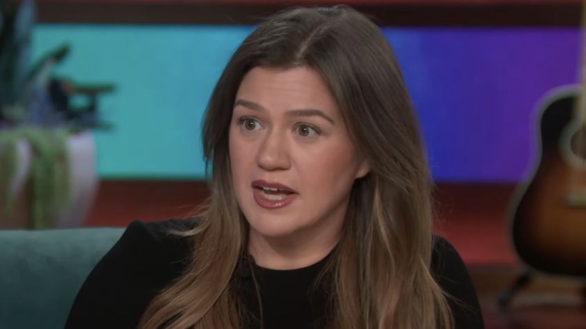 Kelly Clarkson in black top talking to Keke Palmer and Jack Whitehall on The Kelly Clarkson Show