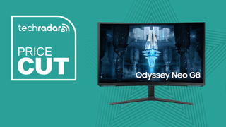 The Samsung Odyssey Neo G8 on a teeal background next to the words "price cut"