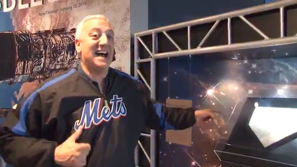 Former NASA astronaut Mike Massimino cheers on the Mets for Game 1 of the 2015 World Series at the Intrepid Sea, Air &amp; Space Museum in New York City, where a Mets home plate that he took into space is on display. 