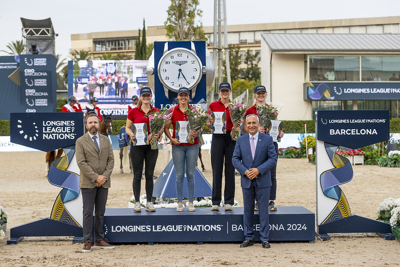 The grooms of the German showjumping team receive their awards at the Longines League of Nations in Barcelona, Spain.