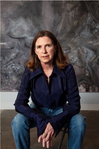 American abstract artist Mary Weatherford in front of a painting from her series The Flaying Marsyas