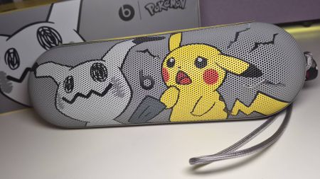 Photo of the Pokemon Beats Pill on a white gaming desk.