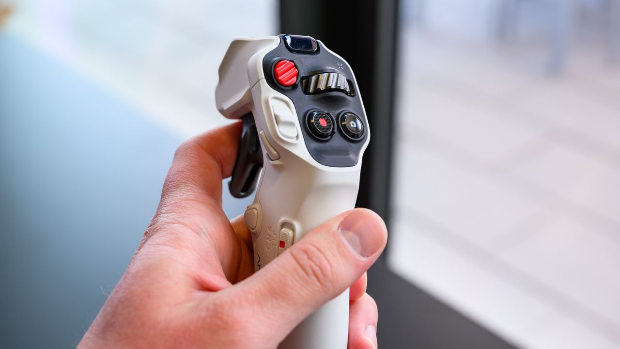 The Antigravity A1 controller in hand.