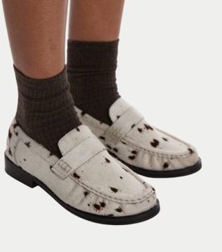 Image of cow print loafers