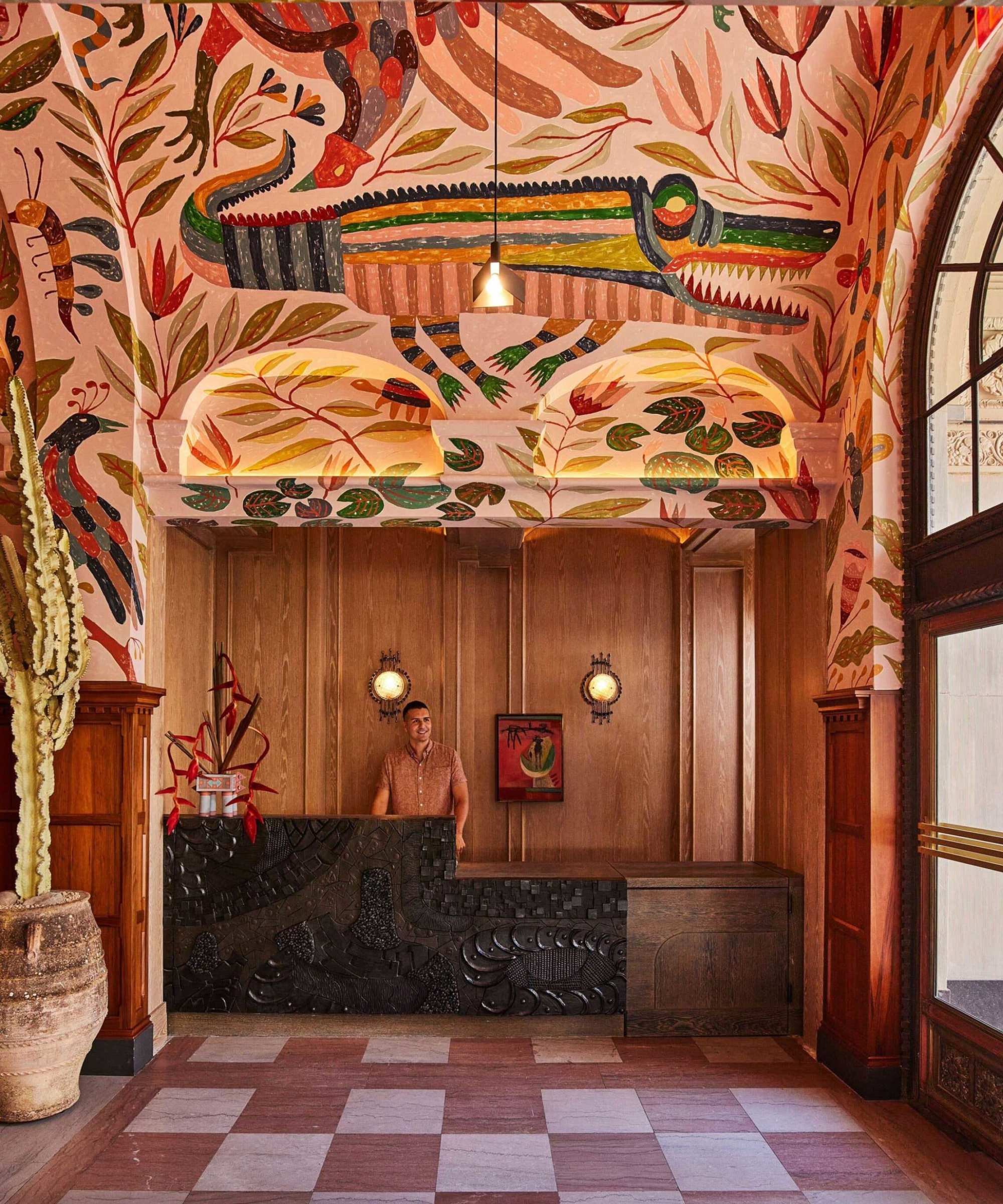 The lobby with a mural on the walls and ceiling