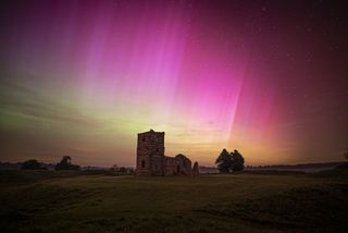 A pink coloured Aurora seen above Knowlton Henge