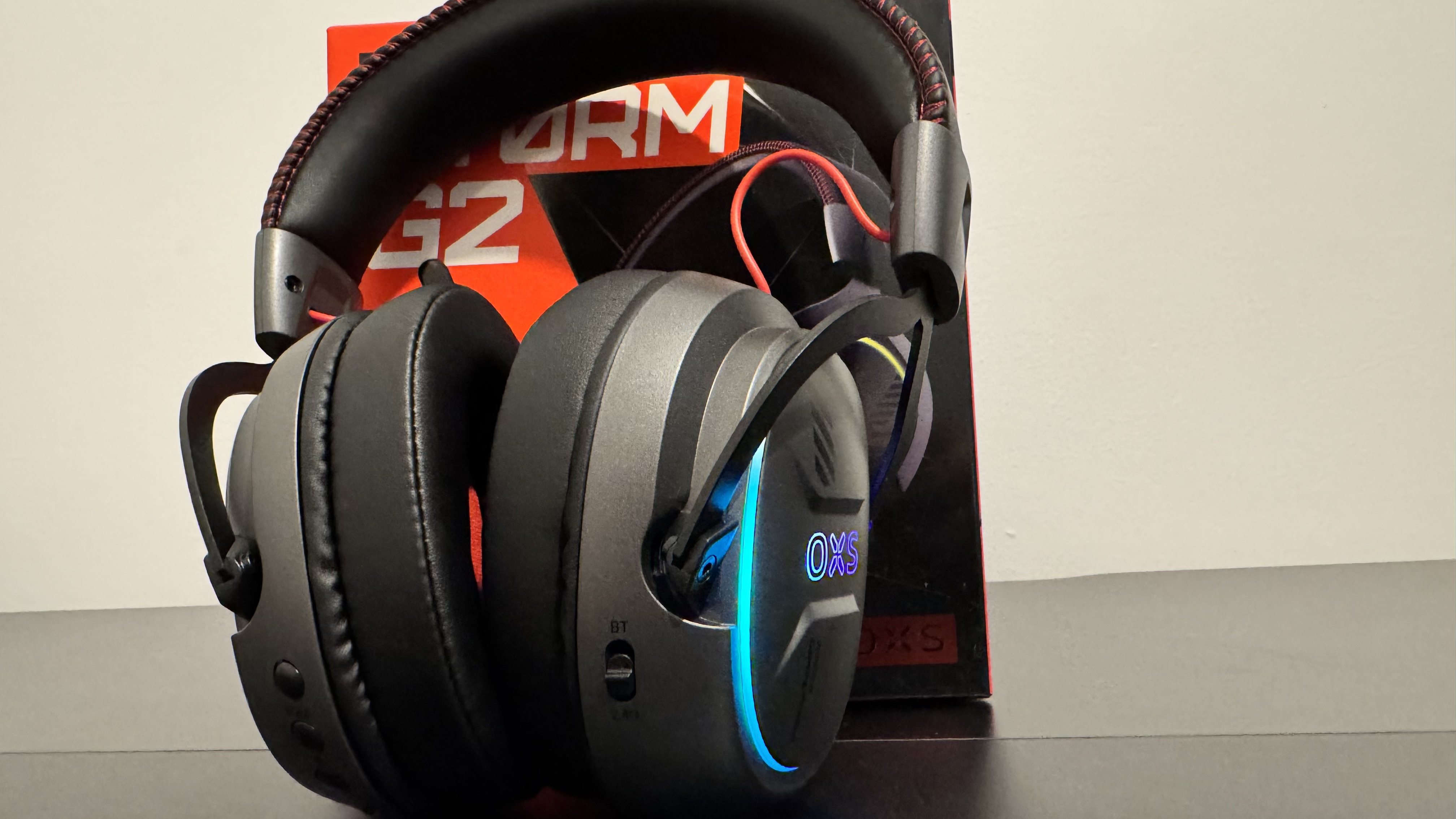 The OXS Storm G2 gaming headset on a black table