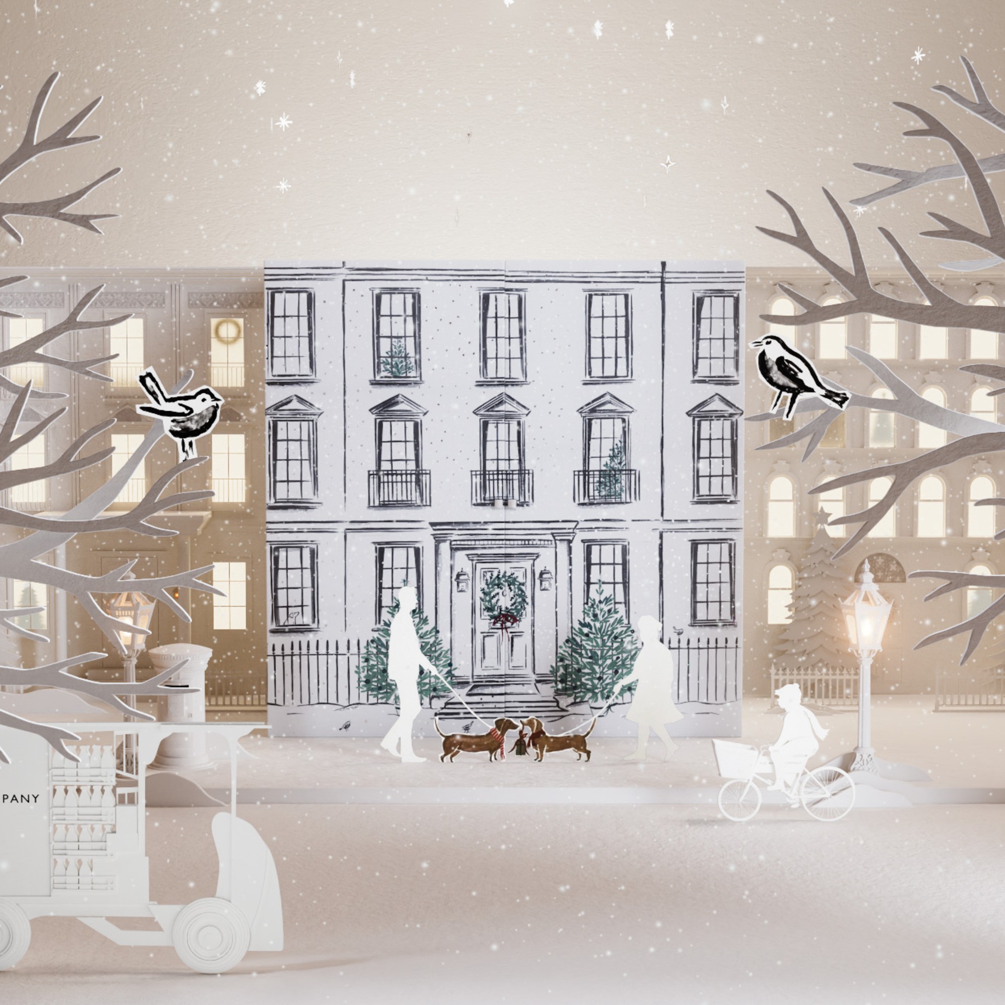 The White Company advent calendar 2026 closed covered with a hand-drawn design and paper cut-out props arranged around it