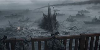 Godzilla swims with battleships