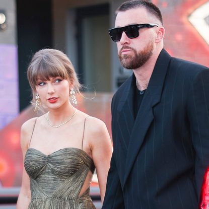 Taylor Swift wears a gold gown and sparkling shoes with Elizabeth Taylor's opal jewelry set