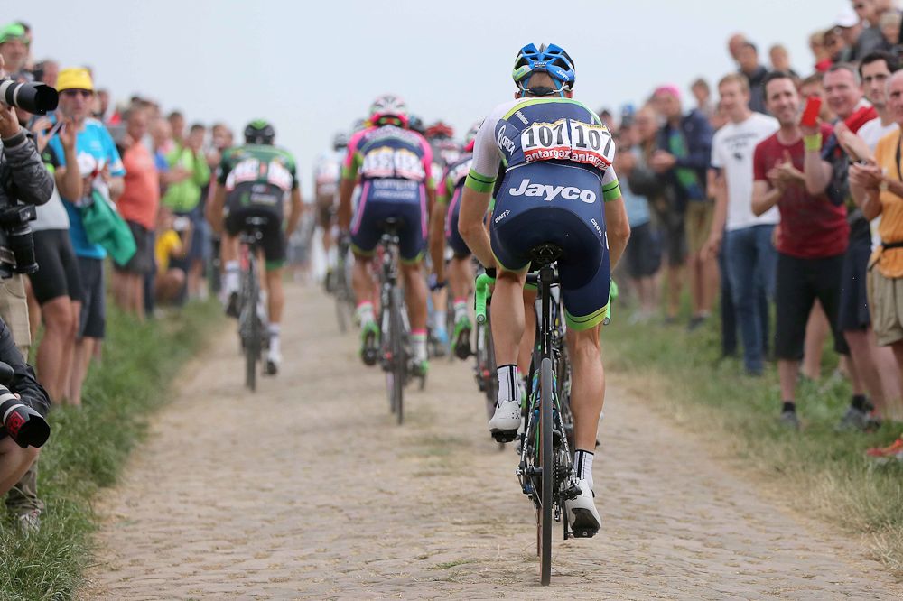 Fans line the cobbled roads during stage 4 of the 2015 Tour de France.