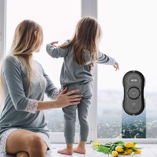 smart robot cleaner on a window with a woman and her child watching