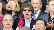 Mick Jagger watches England play football