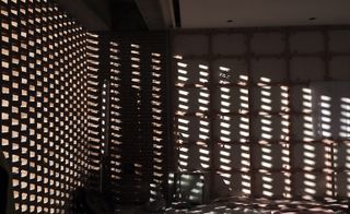A brick screen in the museum’s conference room