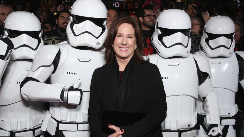 Kathleen Kennedy standing with a bunch of Stormtroopers