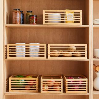 Bamboo cubby boxes in cabinet