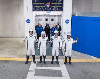 The crew-2 astronauts walk out before launch April 23, 2021.