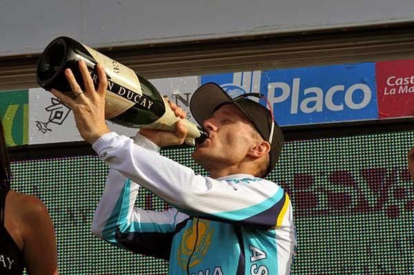 And he cuts loose with a big swig of the bubbly