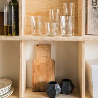 wooden shelve with drinks and glass