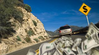Sports Utility Vehicle driving on a mountain highway road with dollar bills blowing from the exhaust