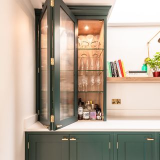 Green Shaker kitchen with fluted glass cabinet