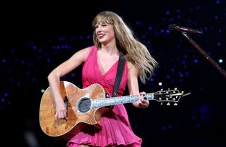 taylor swift wears a new pink sleeveless dress on the eras tour in paris in may 2024