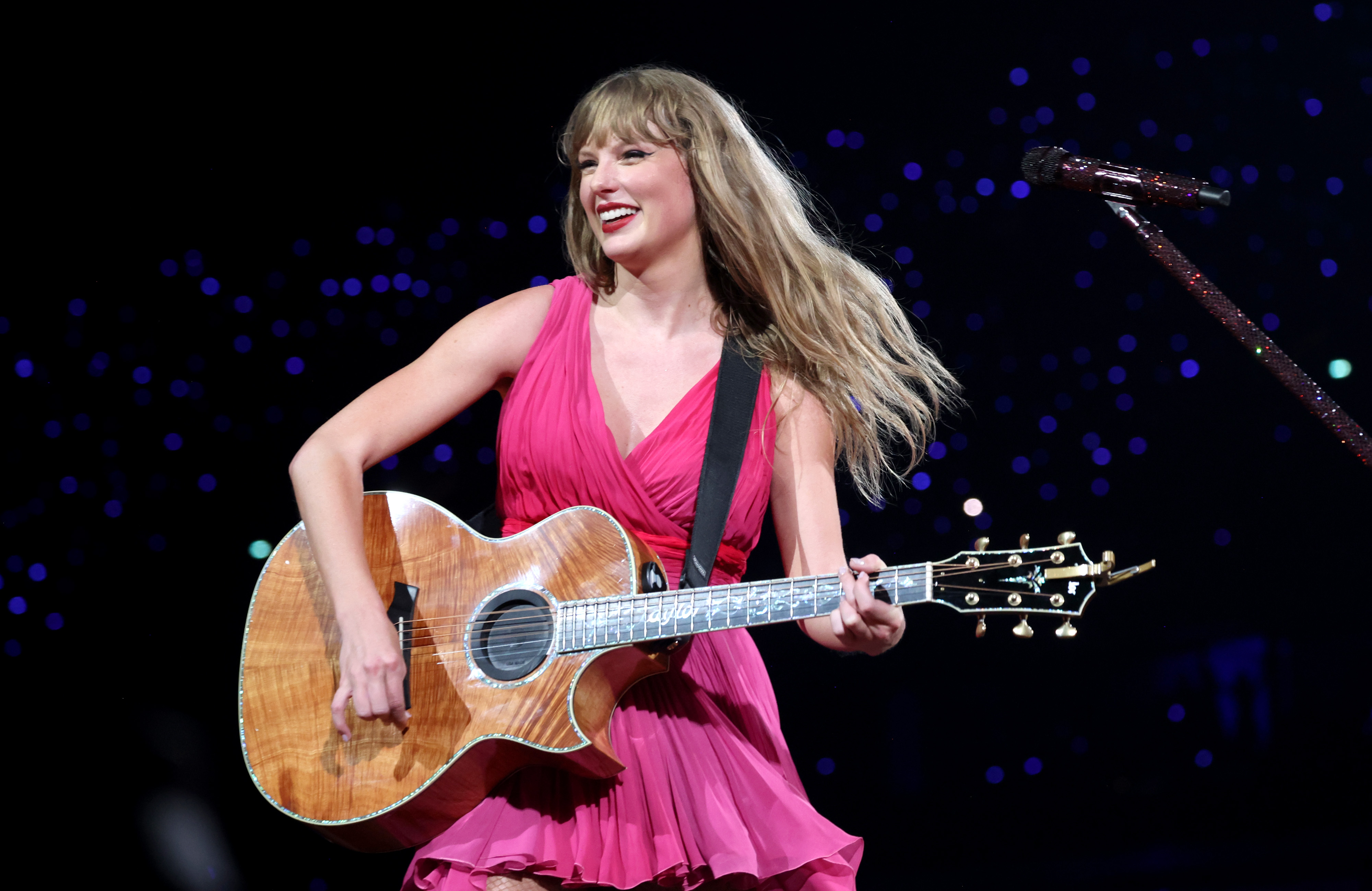 taylor swift wears a new pink sleeveless dress on the eras tour in paris in may 2024