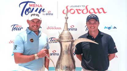 Callum Shinkwin poses with Lee Westwood after he secured one of the three qualifying places during the 2019 MENA Tour Omega Dubai Desert Classic ShootOut qualifying event