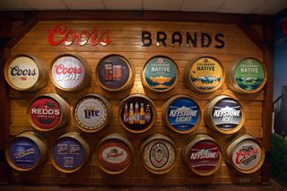 Sign showing all the Coors brands