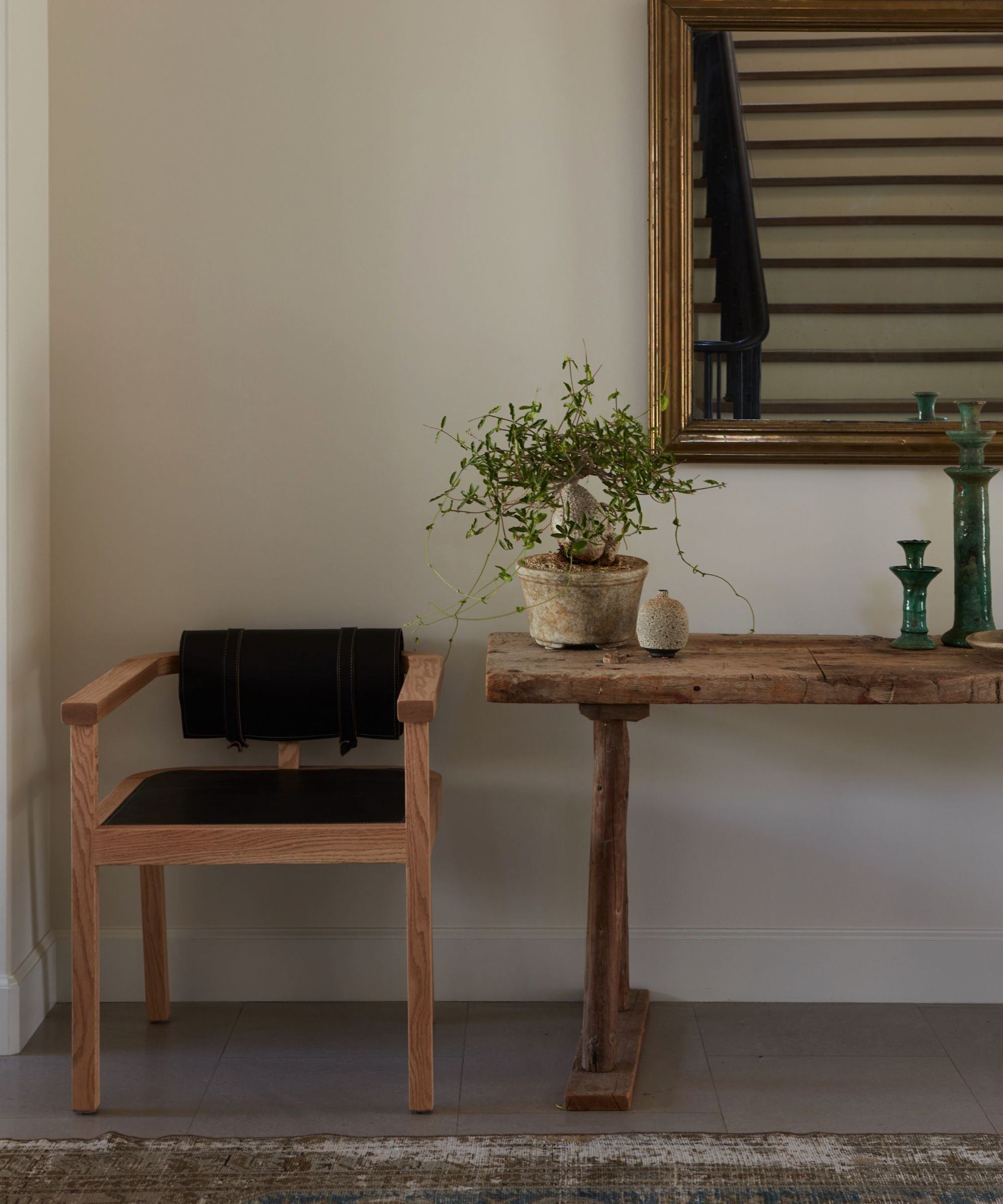 modern organic entryway with console table rug and mirror