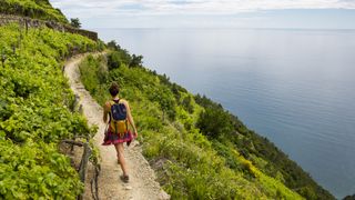 cinque terre hikes: hiker on coastal path