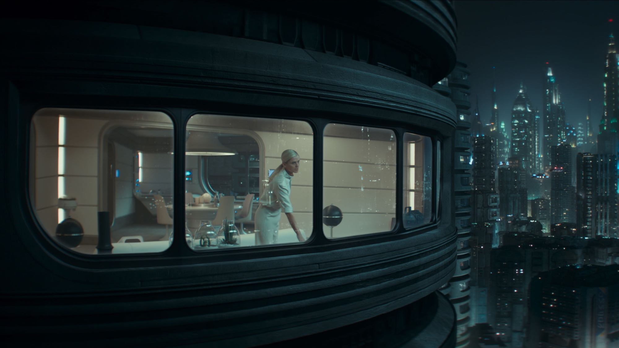 Dedra Meero (Denise Gough) looks outside the window in her apartment on Andor.