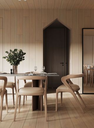 a dining room with natural wood walls