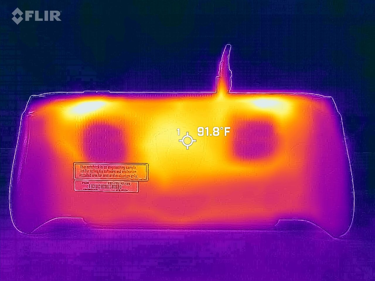 Rear thermal view of the console under load, showing two cooler circular intake areas over the internal fans and a center chassis temperature of 91.8&deg;F.