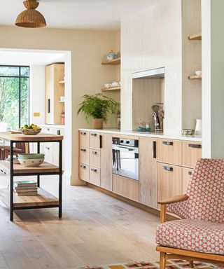 modern kitchen with oak wood and light green tiles