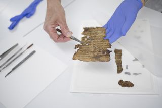 Researchers work to conserve the Dead Sea Scrolls at the Israel Antiquities Authority's lab.