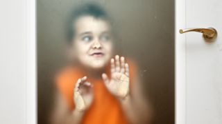 A boy presses his face up to the glass in this humourous photo, taken by Jose R. Moreno in Logroño, Spain.