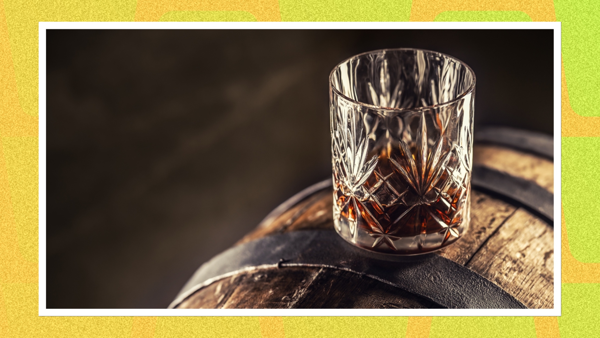 Whiskey glass on a barrel