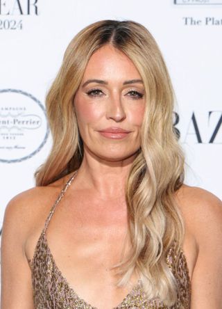 TV presenter Cat Deeley in a gold strappy dress