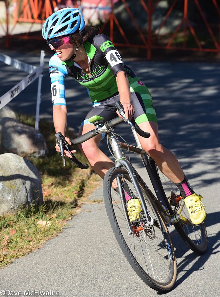 Julie Wright (Team Averica) rounding a corner on the pavement with two laps remaining