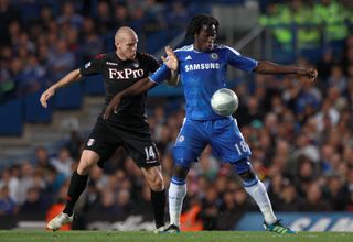 Fulham’s Philippe Senderos (left) and Chelsea’s Romelu Lukaku in action