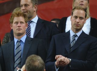 Prince William and Prince Harry arrive to attend the 2010 World Cup group C first round football match between England and Algeria on June 18, 2010 at Green Point stadium in Cape Town.