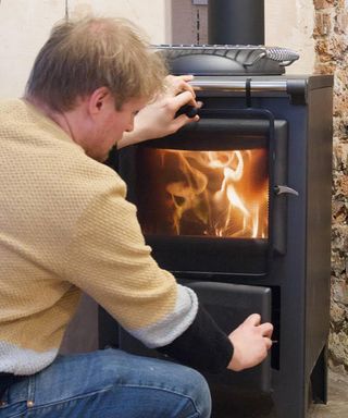 Designer Sebastian Cox with wood burner stove