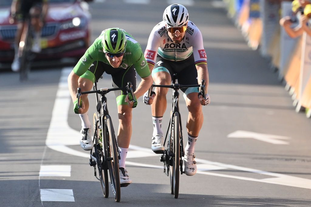 Team Deceuninck rider Irelands Sam Bennett wearing the best sprinters green jersey L and Team Bora rider Slovakias Peter Sagan cross the finish line at the end of the 19th stage of the 107th edition of the Tour de France cycling race 160 km between BourgenBresse and Champagnole on September 18 2020 Photo by Marco BERTORELLO POOL AFP Photo by MARCO BERTORELLOPOOLAFP via Getty Images