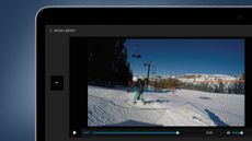 A laptop on a blue background showing the GoPro Quik app