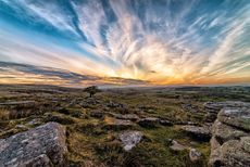 At once wild and wonderful: Combestone Tor overlooking the panorama of Dartmoor. Credit: Will Tudor via Getty