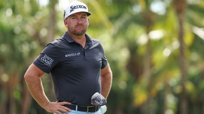 Graeme McDowell looks on during a tournament with his driver in hand