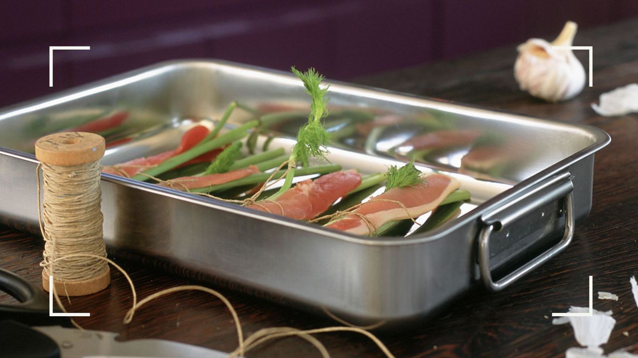  baking tray with ingredients ready to place in the oven, to illustrate w&amp;h&#039;s guide to how to clean oven trays