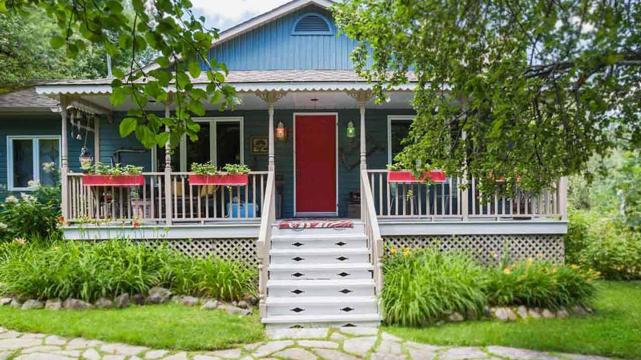 A house with a quaint front porch.