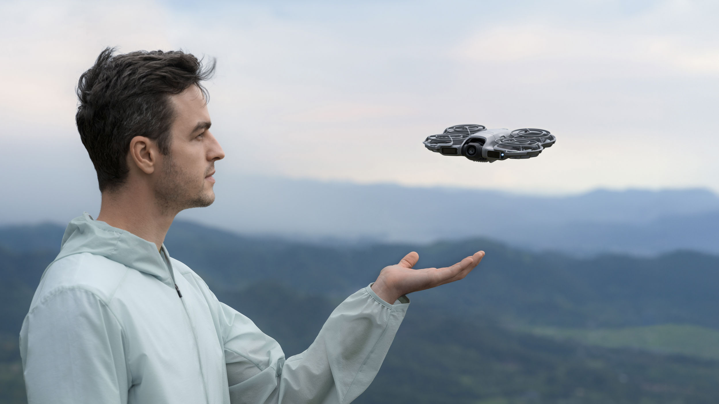 DJI Neo 2 selfie drone taking off from a man's hand